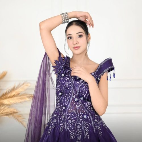 The unique shoulder cape detailing enhances sophistication, making it perfect for weddings, rec